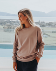 Active mother wearing matching grey women's crew sweatshirt