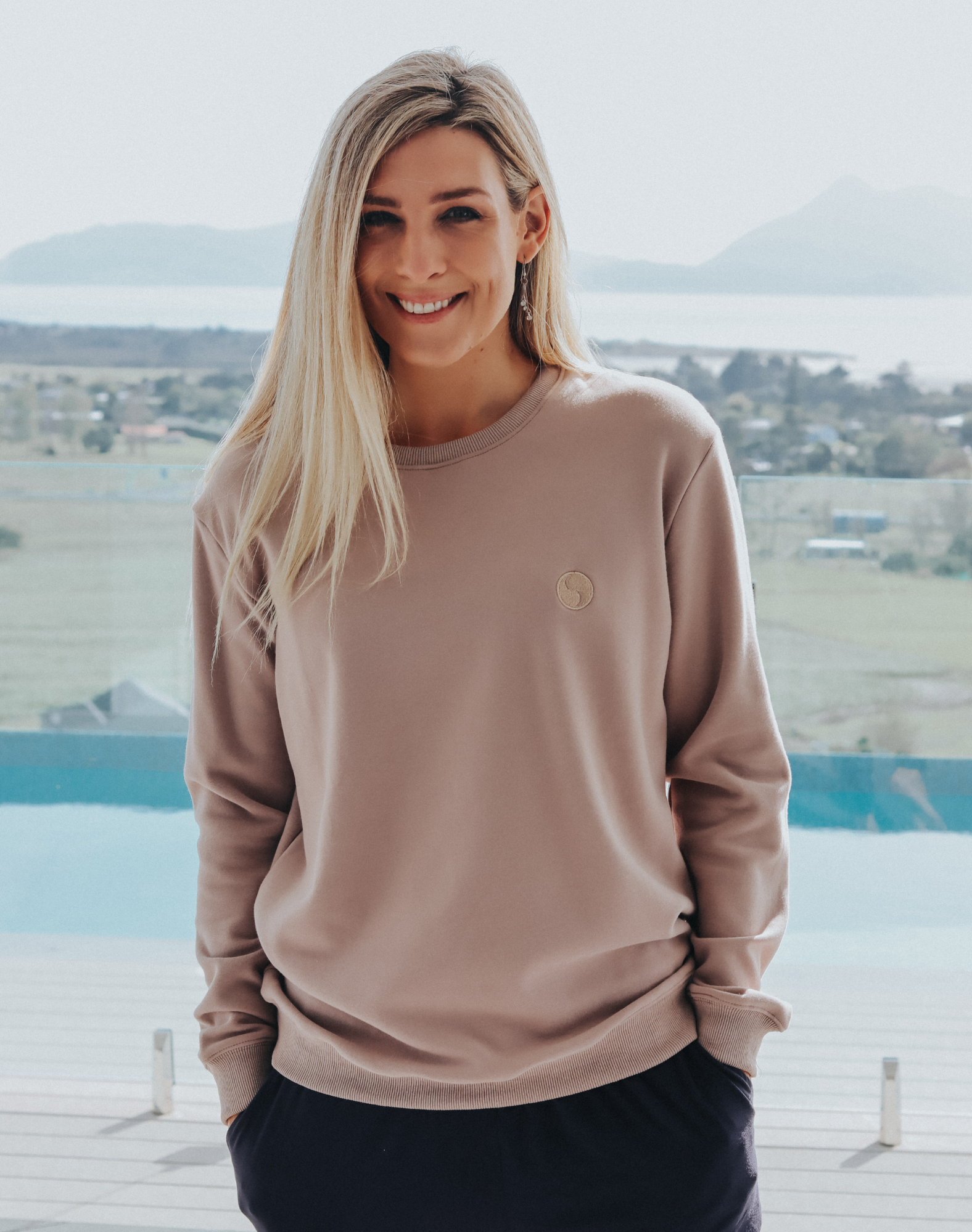 Happy mother wearing a grey women&#39;s crew neck sweatshirt