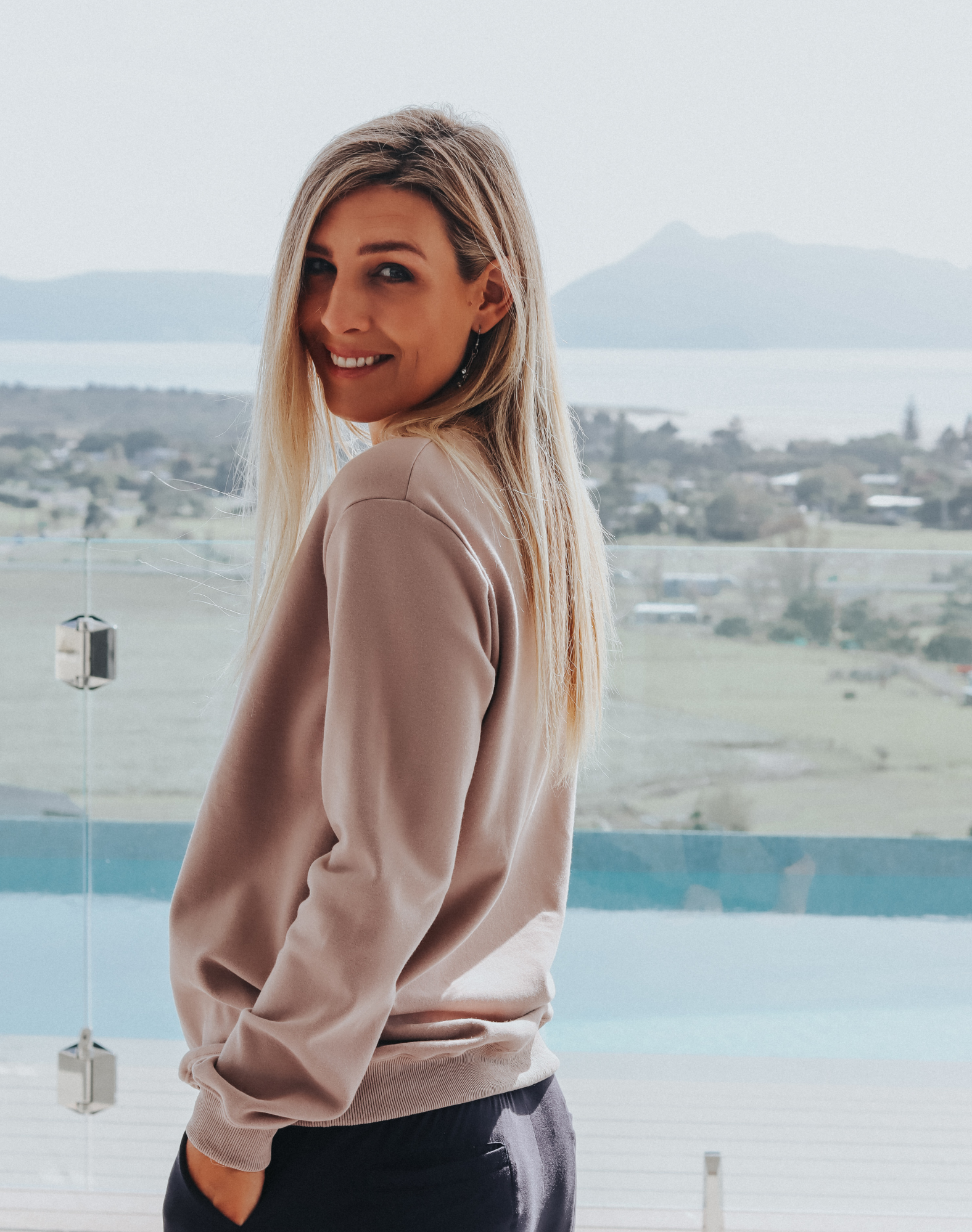 Side view of grey women&#39;s crew sweatshirt